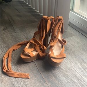 Worn strappy tan heels